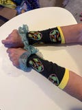 Fandom lace trimmed arm warmers. Priced per pair. Hand wash.
